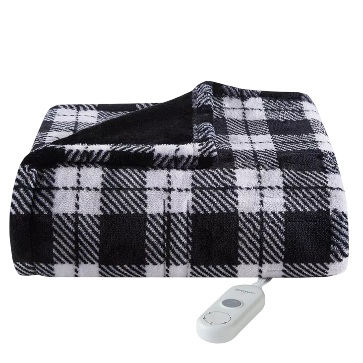 A black and white plaid electric blanket with a remote control.