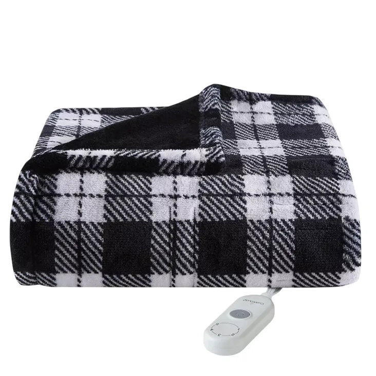 A black and white plaid electric blanket with a remote control.