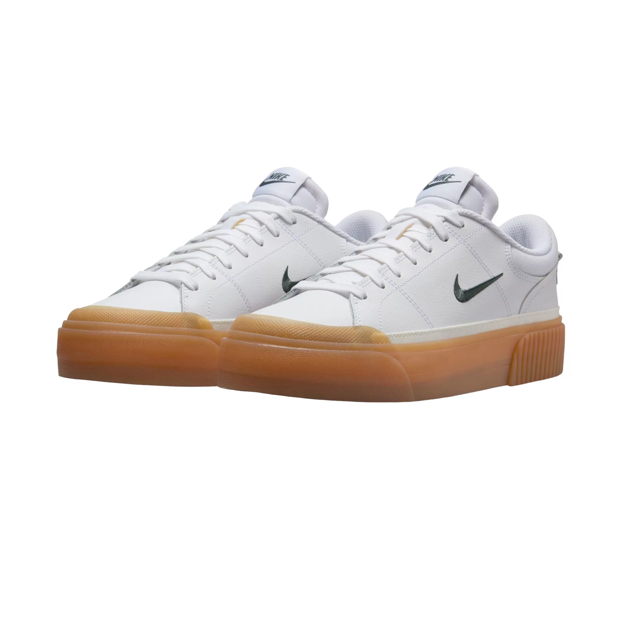 A pair of white Nike sneakers with a gum brown sole and a small grey Nike swoosh on the side.