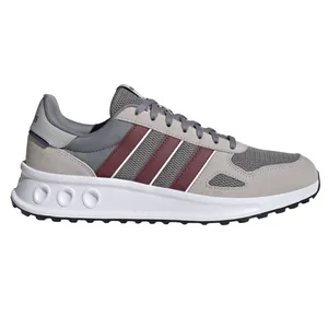 A gray sneaker featuring burgundy and white stripes, with a cushioned white sole and textured upper material.