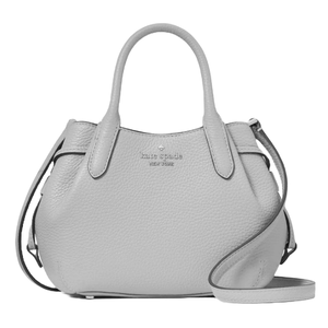 A gray Kate Spade New York handbag with two top handles and a removable strap, featuring pebbled leather texture.