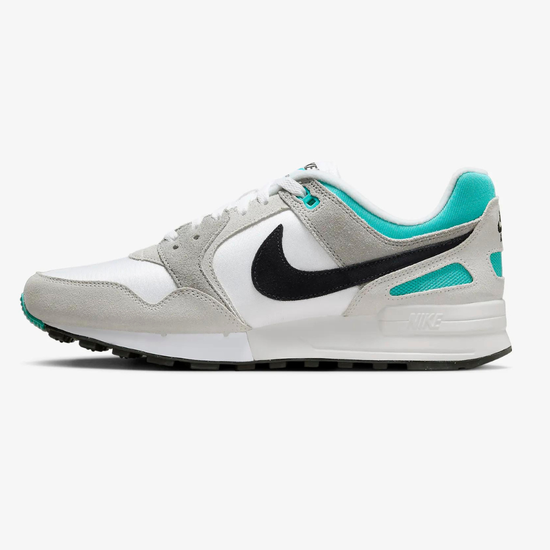 A white and grey sneaker with black Nike swoosh logo and teal accents.