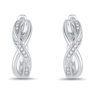 Silver hoop earrings with a twisted design, featuring embedded small, round diamonds.