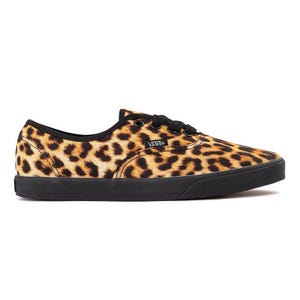 A Vans sneaker with a leopard print pattern features black laces and a black sole.