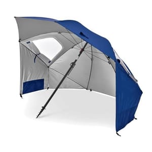 Blue and gray Sport-Brella Sun Umbrella featuring a large, angled canopy with side flaps for full protection. It includes a telescoping pole with a screw anchor for stability, and has internal pockets for storage.