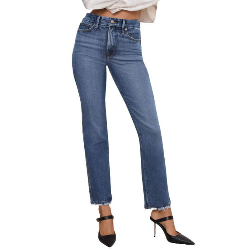A pair of high-waisted, straight-leg blue jeans with frayed hems, paired with black pointed-toe heels featuring an ankle strap.