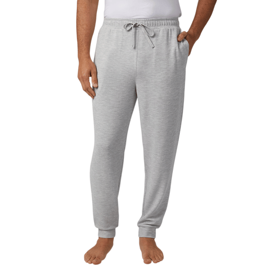 Light gray sweatpants with an adjustable drawstring waist and cuffed ankles, worn by a person with bare feet.