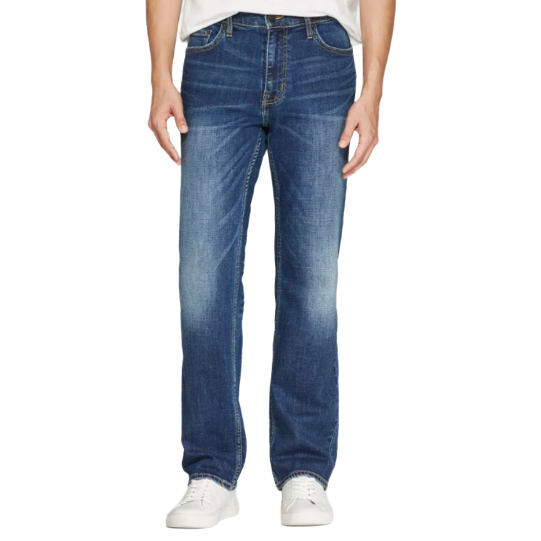 A person is wearing blue straight-leg jeans paired with white sneakers and a white shirt. The jeans feature a slight fade effect on the thighs and knees.