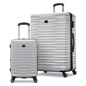 A silver hard-shell luggage set with two pieces, featuring textured surfaces, telescopic handles, and four-wheel spinners for easy maneuvering.