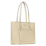 A beige tote bag with long handles, featuring an exterior pocket and a minimalist design.