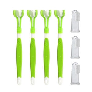 Three green and white toothbrushes alongside three transparent toothbrush protectors.