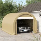 A beige fabric carport covers a black car beside a building, providing a protective shelter.