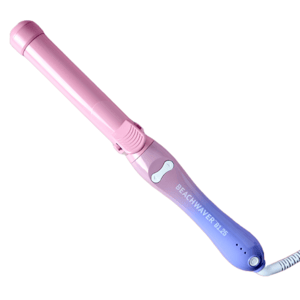 The Beachwaver B1.25 is a pink and purple automatic rotating curling iron designed for creating loose beachy waves. It features a clamp and an ergonomic handle.