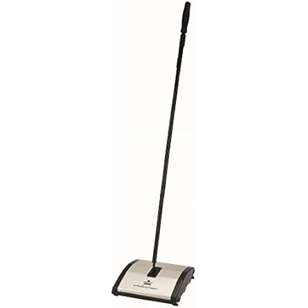 Bissell Mechanical Sweeper with a black handle and a compact, rectangular base designed for quick floor cleaning without electricity. The sweeper has a simple, lightweight design suitable for everyday use.