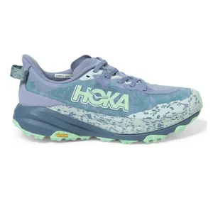 Hoka trail running shoe in lavender and mint green with a Vibram sole and a patterned midsole.
