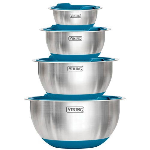 A set of stainless steel mixing bowls with blue non-slip bases and lids, marked with the brand \“Viking\“. The bowls are nested in four different sizes.