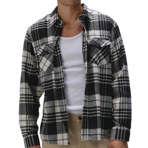 RSQ Men's Plaid Flannel features a black and white plaid pattern with a button-up front, chest pockets, and long sleeves, worn over a white shirt.