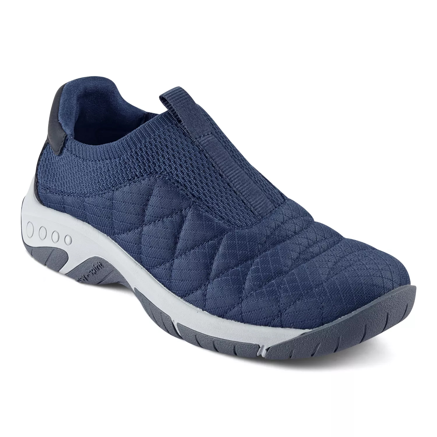 Slip-on sneaker with cushioned, quilted design in navy blue, featuring a flexible sole and knit upper.