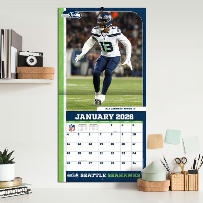 Seattle Seahawks wall calendar for January 2026, featuring a player in game action.