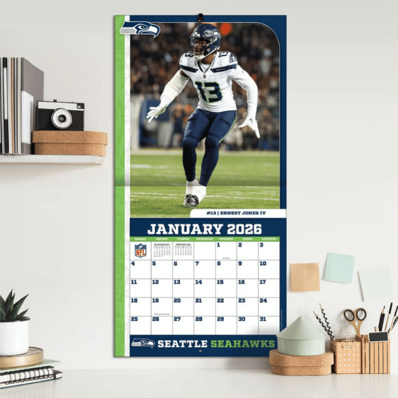 Seattle Seahawks wall calendar for January 2026, featuring a player in game action.
