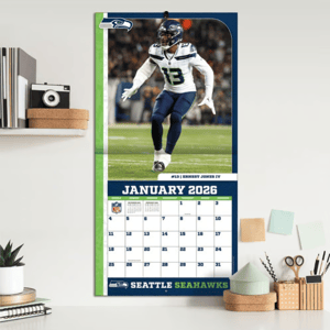 Seattle Seahawks wall calendar for January 2026, featuring a player in game action.