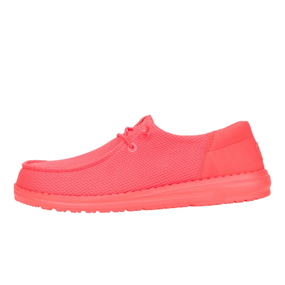 Bright red casual shoe with a textured fabric upper, lace-up design, and cushioned sole.