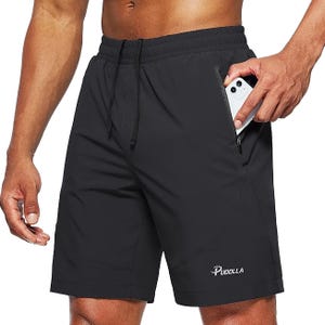 Black men's workout shorts featuring an elastic waistband with a drawstring, zipper pockets, and a small logo \“Pudolla\“ on the left leg.