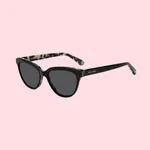 Black cat-eye sunglasses with dark lenses and patterned arms, featuring the Kate Spade logo on the side.