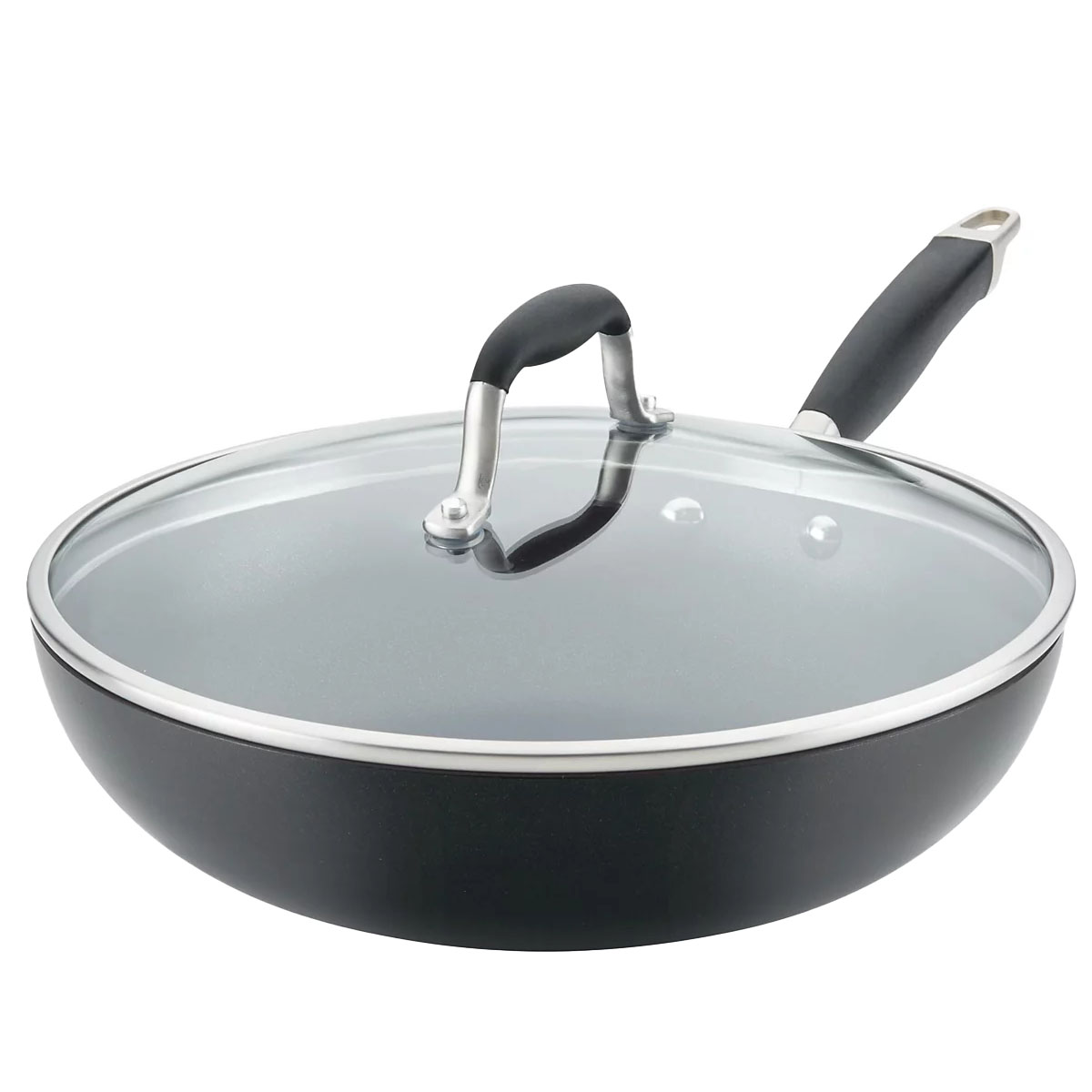 Black frying pan with a glass lid and a black handle.