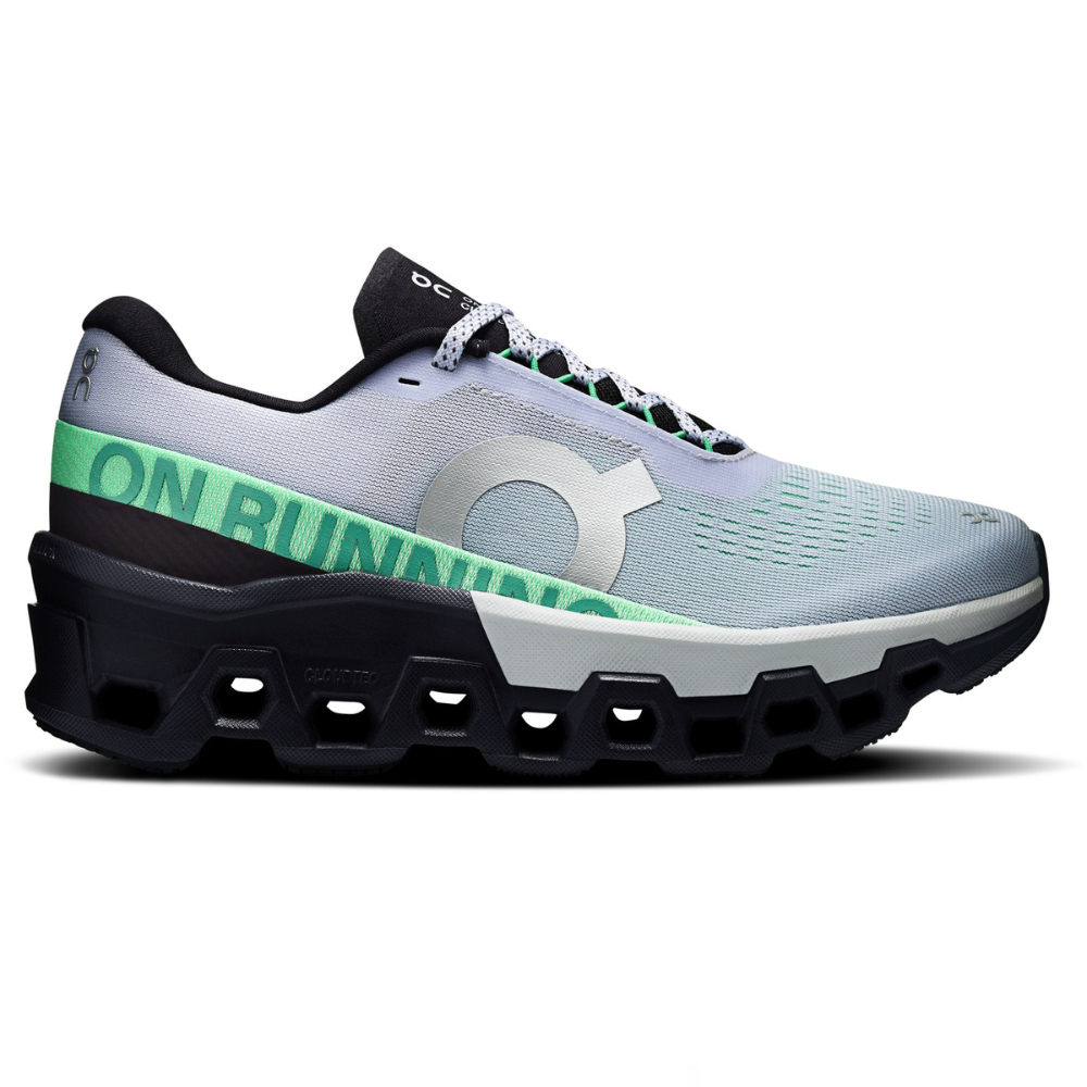 Running shoe with a grey and mint green upper, prominent side logo, black sole, and unique cushioning design.