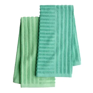 Two striped, textured towels in shades of green are shown, featuring a vertical pattern.