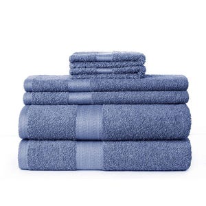 A set of neatly stacked blue towels in varying sizes.