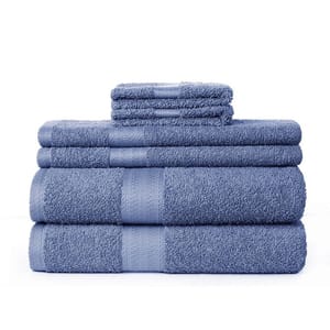 A set of neatly stacked blue towels in varying sizes.