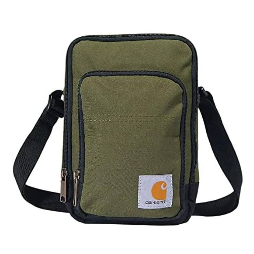 Olive green Carhartt crossbody bag with a front zip pocket, black trim, and adjustable strap, featuring the brand's logo on a patch at the bottom.