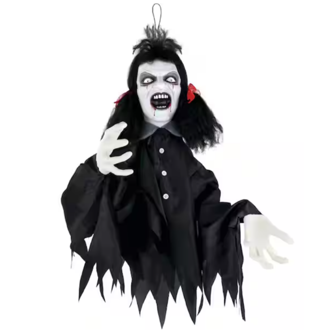 Hanging Halloween decoration featuring a ghostly figure with a white face, black hair with red bows, sharp teeth, and a tattered black garment.