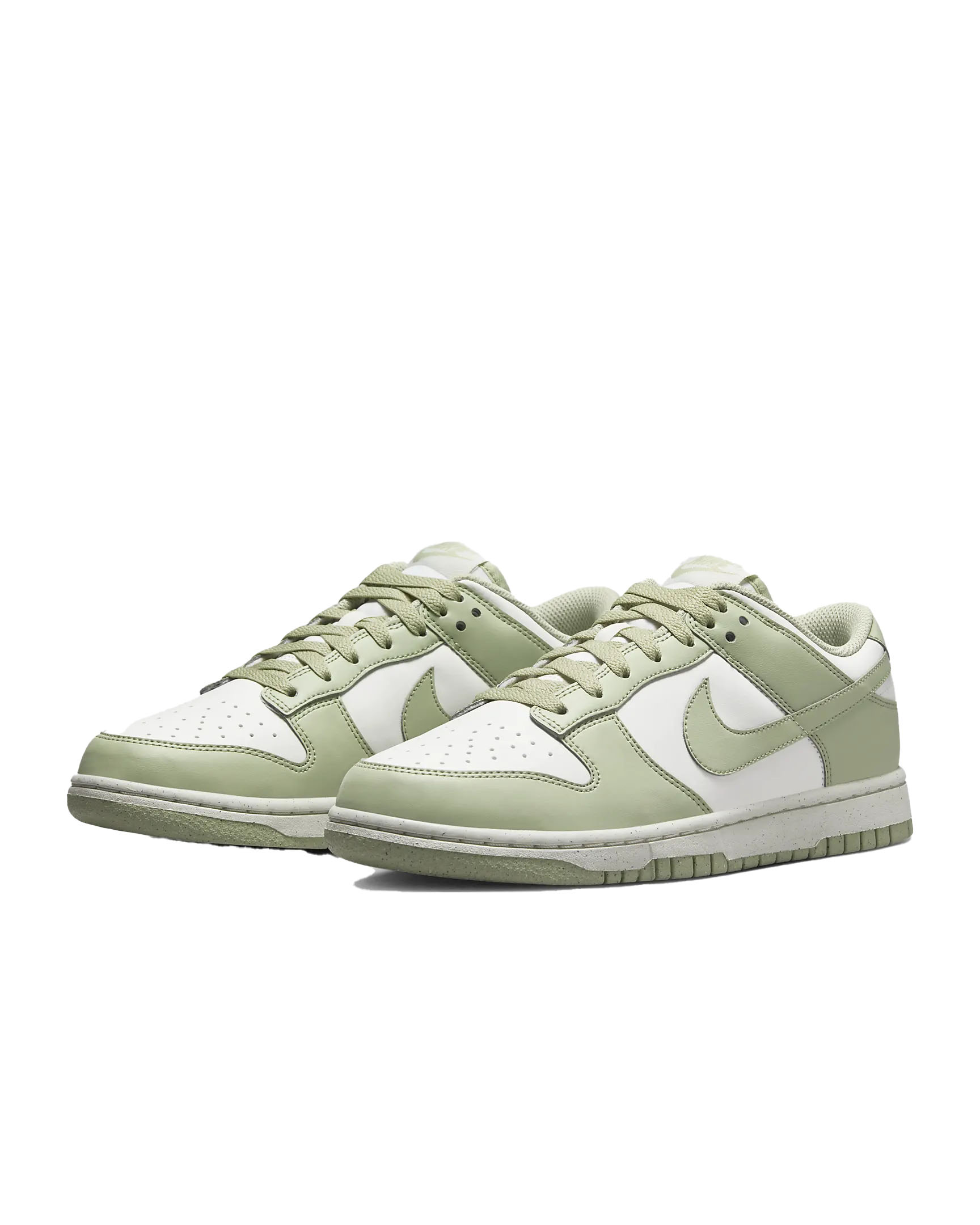 Nike Dunk Low shoes in light green and white, featuring a classic low-top design with a leather upper, perforated toe box, and iconic Swoosh logo. They have a stitched rubber outsole for durability and traction.