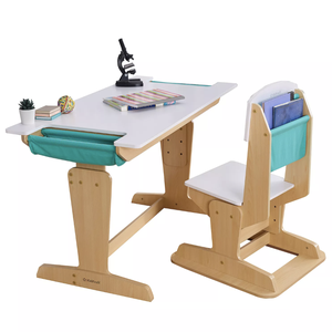 Children's adjustable wooden desk and chair set featuring teal fabric storage pockets, a white desktop, and a chair backrest for organizing books. Includes a small plant, books, and a microscope on the desk.