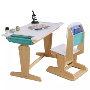 Children's adjustable wooden desk and chair set featuring teal fabric storage pockets, a white desktop, and a chair backrest for organizing books. Includes a small plant, books, and a microscope on the desk.