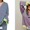 a green and pink striped long sleeve shirt from amazon besides a similar green and pink striped long sleeve shirt from Free People