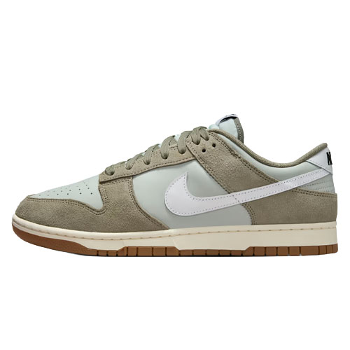 Nike Dunk Low in a neutral colorway with suede and leather materials, featuring a white Swoosh and a gum sole.