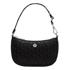 Black shoulder bag with a subtle zigzag pattern, featuring a small metal logo at the front, a detachable strap, and a secure zipper closure.