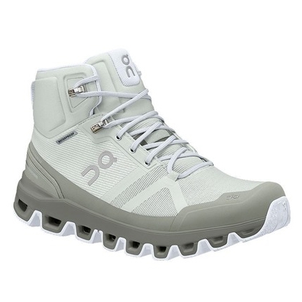 On Cloudrock Waterproof Shoes are light grey high-top hiking boots with a robust sole, lace-up closure, and waterproof material, designed for outdoor activities.