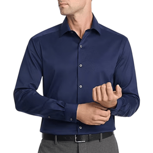 A man wearing a dark blue long-sleeve button-up shirt with a pointed collar, paired with gray pants and a black belt.