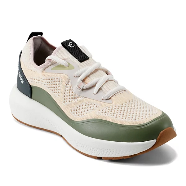 A casual sneaker with a breathable knit upper, lace-up design, and cushioning sole. It features green accents and a white, slightly elevated midsole for added comfort.