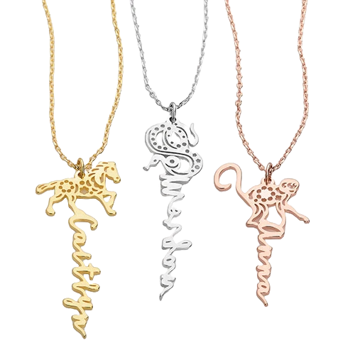 Three necklaces featuring Chinese Zodiac designs: a gold horse with \“Caitlyn,\“ a silver snake with \“Samantha,\“ and a rose gold monkey with \“Anna,\“ each with its chain.
