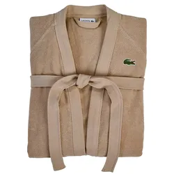 A beige Lacoste bathrobe with a belt and the brand's crocodile logo on the chest.