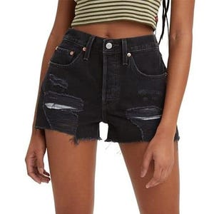 Levi's Women's 501 Original Shorts feature a high-waisted fit with a button fly, distressed detailing, and frayed hem. They are classic denim in black with five-pocket styling.
