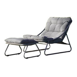 A padded lounger with footrest, upholstered in gray fabric with a metal frame.