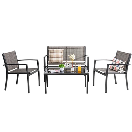 A 4-piece patio conversation set includes a loveseat, two armchairs, and a glass-top coffee table, featuring a sleek metal frame with mesh seating and backrests, accompanied by decorative cushions.