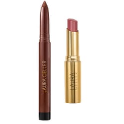 Laura Geller makeup items: a dark brown eyeshadow stick and a pink lipstick in gold packaging.